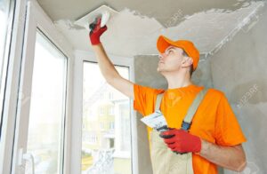 24207680-plasterer-at-indoor-ceiling-renovation-decoration-with-float-and-plaster